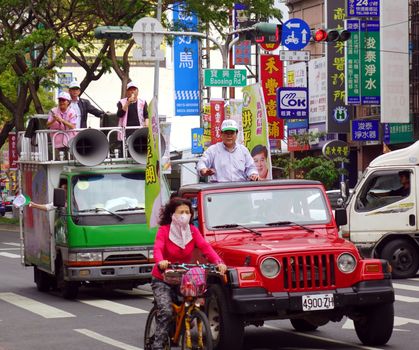 KAOHSIUNG, TAIWAN -- MARCH 27, 2014: City council candidate Hong Ping Lang campaigns in the run up for the 2014 local elections.