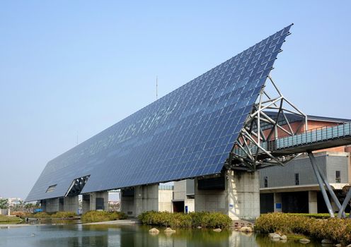 TAINAN, TAIWAN -- MARCH 4, 2014: A giant wall of solar panels is a distinctive feature of the National Museum of Taiwan History in Tainan City which was completed in 2012.