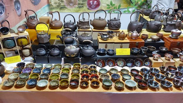 KAOHSIUNG, TAIWAN -- APRIL 5, 2019: A stall sells teapots and teacups at a sales and promotion event.
