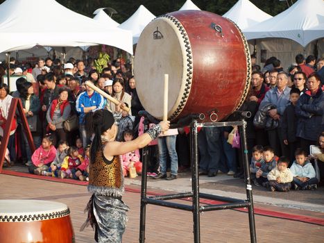 KAOHSIUNG, TAIWAN - JANUARY 23: The Japanese percussion group TenDrum performs outside the Cultural Center for the Chinese New Year on January 23, 2012 in Kaohsiung