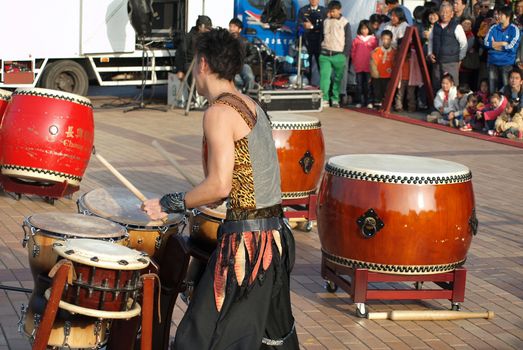 KAOHSIUNG, TAIWAN - JANUARY 23: The Japanese percussion group TenDrum performs outside the Cultural Center for the Chinese New Year on January 23, 2012 in Kaohsiung