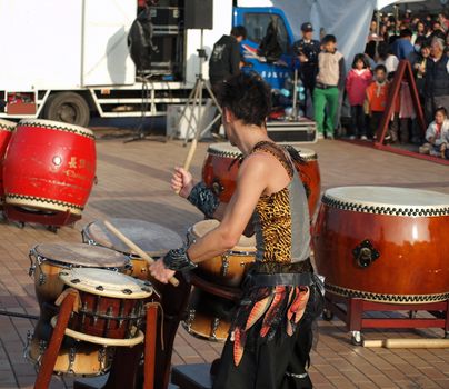 KAOHSIUNG, TAIWAN - JANUARY 23: The Japanese percussion group TenDrum performs outside the Cultural Center for the Chinese New Year on January 23, 2012 in Kaohsiung