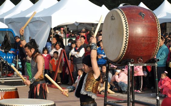 KAOHSIUNG, TAIWAN - JANUARY 23: The Japanese percussion group TenDrum performs outside the Cultural Center for the Chinese New Year on January 23, 2012 in Kaohsiung