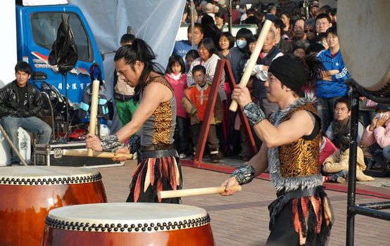 KAOHSIUNG, TAIWAN - JANUARY 23: The Japanese percussion group TenDrum performs outside the Cultural Center for the Chinese New Year on January 23, 2012 in Kaohsiung