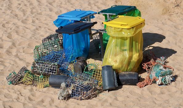 Waste separation at a beach with fish traps