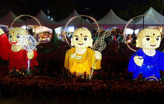 KAOHSIUNG, TAIWAN -- FEBRUARY 9, 2019: Three lanterns in the shape of Buddhist monks are on display at the Lantern Festival.
