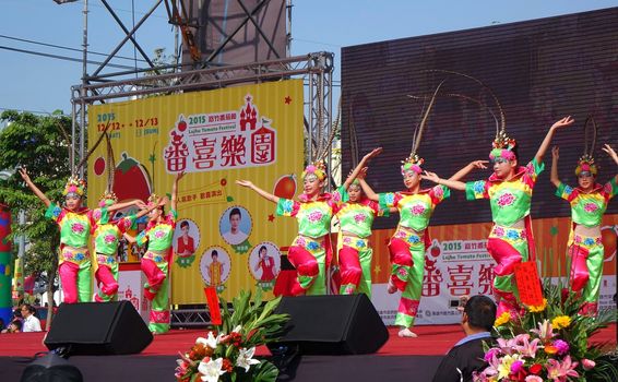 LUJHU, TAIWAN -- DECEMBER 12, 2015: Children dressed up in colorful costumes perform a traditional Chinese dance at the 2015 Lujhu Tomato Festival.