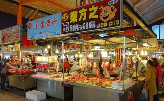 KAOHSIUNG, TAIWAN -- JANUARY 22, 2015: A traditional wet food market in Kaohsiung sells pork and seafood products.