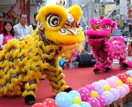 KAOHSIUNG, TAIWAN -- NOVEMBER 20, 2015: Traditional Chinese lion dancers perform at the opening ceremony of the Jiangguo Outdoor Market.
