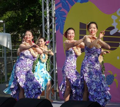 KAOHSIUNG, TAIWAN -- APRIL 23, 2016: A group of unidentified dancers performs a Hawaiian dance at the 1st Pacific Rim Ukulele Festival, a free outdoor event.