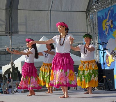 KAOHSIUNG, TAIWAN -- APRIL 23, 2016: A group of unidentified dancers performs a Hawaiian dance at the 1st Pacific Rim Ukulele Festival, a free outdoor event.