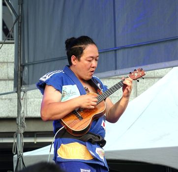 KAOHSIUNG, TAIWAN -- APRIL 23, 2016: Award-winning Japanese musician Yuta Uchiumi performs at the 1st Pacific Rim Ukulele Festival, a free outdoor event.