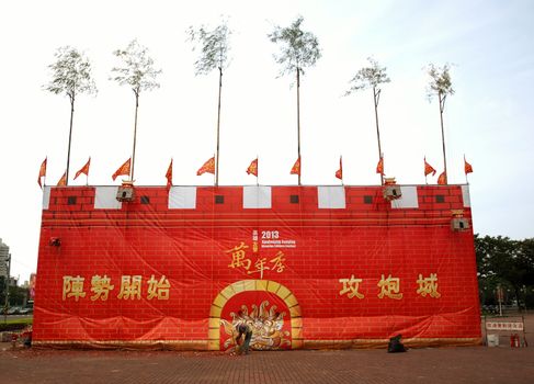 KAOHSIUNG, TAIWAN -- OCTOBER 13: A street sweeper cleans up litter from firecrackers at the entrance to the yearly Wannian Folklore Festival on October 13, 2013 in Kaohsiung.