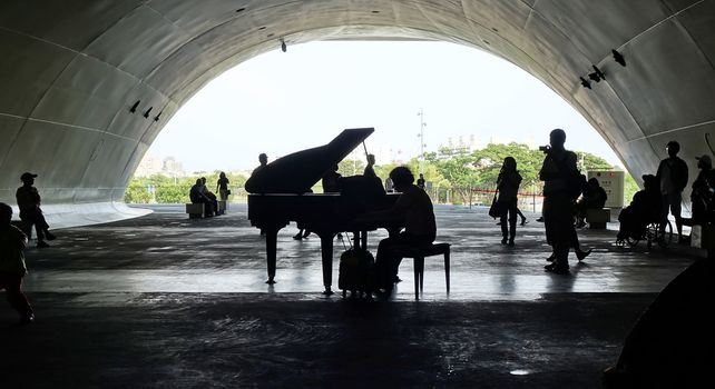 KAOHSIUNG, TAIWAN -- APRIL 14, 2019: A piano performance in the ipublic areas of the recently completed National Center for the Performing Arts located in the Weiwuying Metropolitan Park