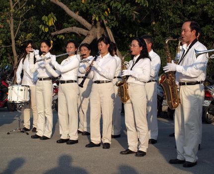 KAOHSIUNG, TAIWAN, JANUARY 26: An unidentified marching band plays for onlookers as part of the activities of the Kaohsiung 2012 Spring Art Festival on January 26, 2012 in Kaohsiung.