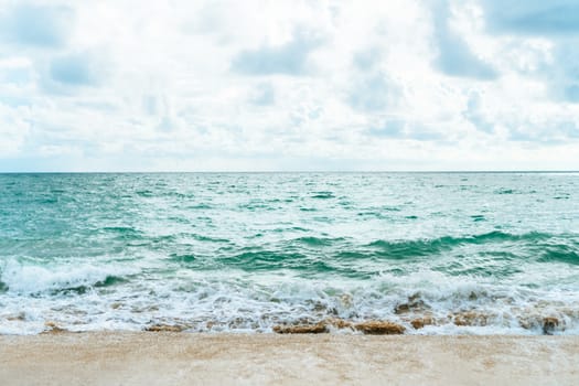 Tropical nature clean beach and white sand in summer with sun light blue sky and bokeh abstract  background.