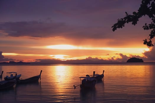 Nature beach scenery in summer time with many boats sunset twilight sky background.