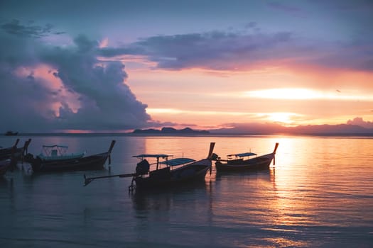 Nature beach scenery in summer time with many boats sunset twilight sky background.