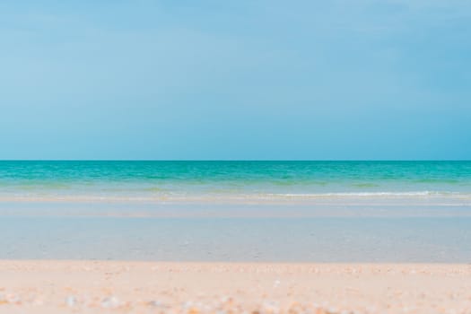 Tropical nature clean beach and white sand in summer with sun light blue sky and bokeh abstract  background.