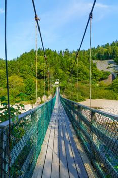 View of the suspension bridge of Big Salmon River, in Fundy Trail Parkway park, New Brunswick, Canada
