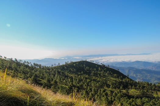 Views of the mountains with colorful sky. And fog in the morning.