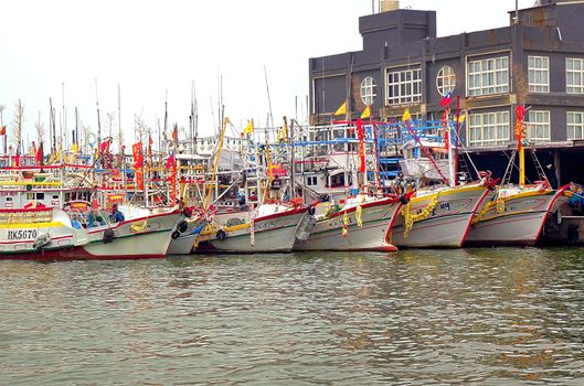 LINYUAN, TAIWAN -- MAY 28, 2017: A fleet of fishing boats is anchored at the port of Zongyungang in southern Taiwan.
