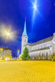 The Fraumunster (Women Minster) Church at night, with Christmas trees, in Zurich, Switzerland