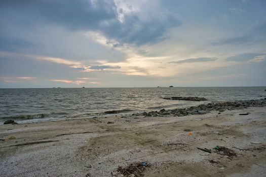 Peaceful beach view and waves during sunset at Jeram, Kuala Selangor Malaysia