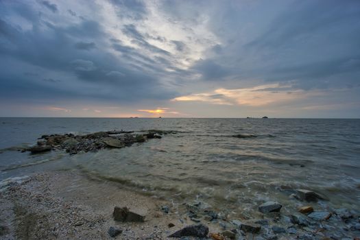 Peaceful beach view and waves during sunset at Jeram, Kuala Selangor Malaysia