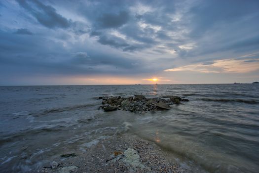 Peaceful beach view and waves during sunset at Jeram, Kuala Selangor Malaysia