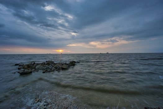 Peaceful beach view and waves during sunset at Jeram, Kuala Selangor Malaysia