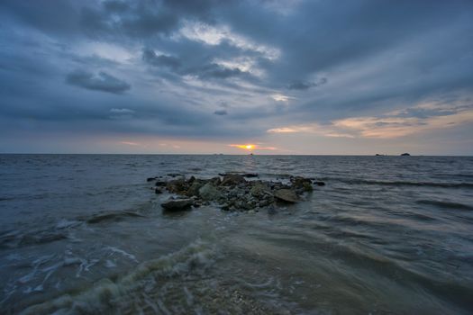 Peaceful beach view and waves during sunset at Jeram, Kuala Selangor Malaysia