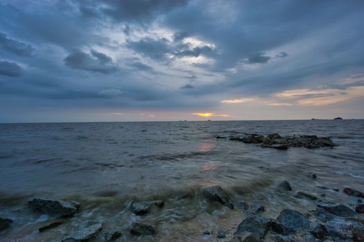 Peaceful beach view and waves during sunset at Jeram, Kuala Selangor Malaysia