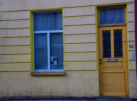 Detail of a house - Yellow door