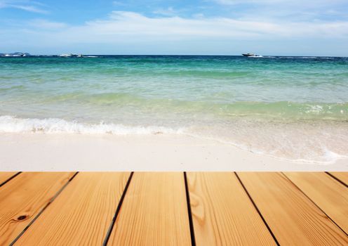 Empty wooden deck table over sea background, Summer concept