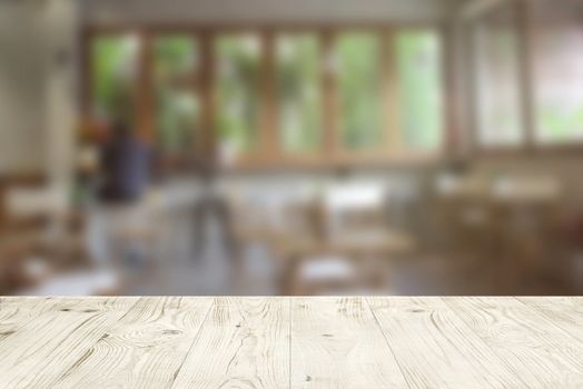 Empty wood table top on blur abstract of cafe or bar background, for montage product display