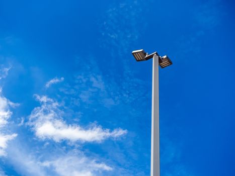 LED street lighting pole. Modern street light on blue sky background with copy space.