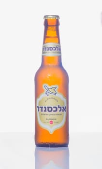 HAIFA, ISRAEL - SEPTEMBER 27, 2014: A bottle of alexander blonde beer, winner of the European beer star competition in 2014 (English-Style Golden Ale category) on a white background in Haifa, Israel