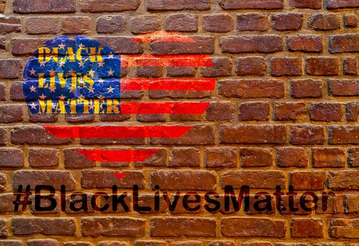 Black Lives Matter hashtag slogan anti Black racism African-American people stencil heart on American flag brick wall background texture stone