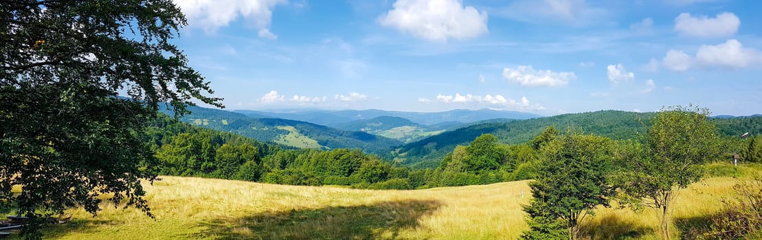 Wide panorama of a idyllic mountain landscape on a sunny day in the morning
