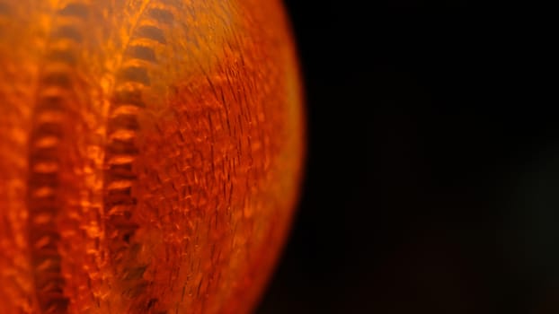 Closeup macro photography of orange glass lamp texture. Illuminated background photo