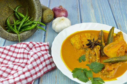 Spicy and tasty fish curry dish, Traditional Malaysian cuisine. Selective focus.