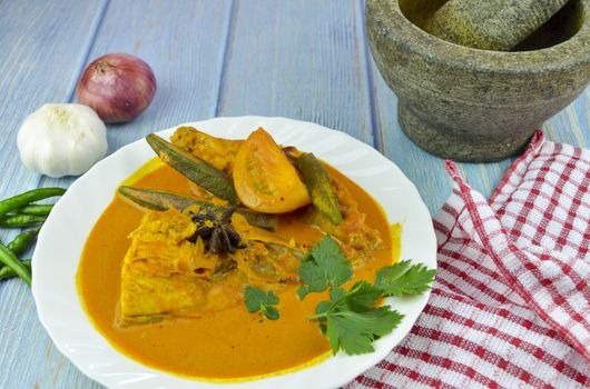 Spicy and tasty fish curry dish, Traditional Malaysian cuisine. Selective focus.