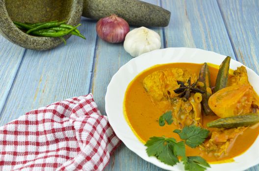 Spicy and tasty fish curry dish, Traditional Malaysian cuisine. Selective focus.