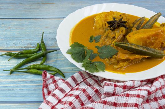 Spicy and tasty fish curry dish, Traditional Malaysian cuisine. Selective focus.