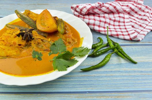 Spicy and tasty fish curry dish, Traditional Malaysian cuisine. Selective focus.