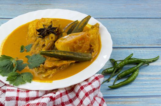 Spicy and tasty fish curry dish, Traditional Malaysian cuisine. Selective focus.