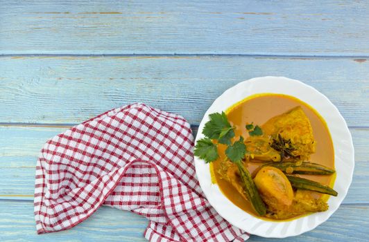 Spicy and tasty fish curry dish, Traditional Malaysian cuisine. Selective focus.