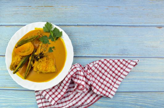 Spicy and tasty fish curry dish, Traditional Malaysian cuisine. Selective focus.