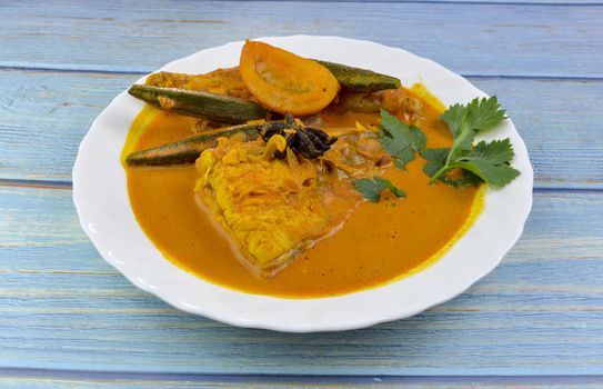 Spicy and tasty fish curry dish, Traditional Malaysian cuisine. Selective focus.